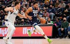 Karl-Anthony Towns of the Wolves got past Mavs center Dwight Powell on Sunday.
