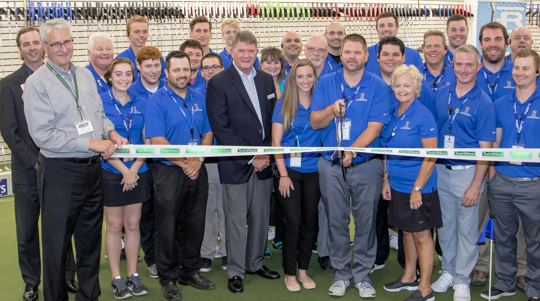 Mayor Pro Tem Dick Allendorf (center in coat), TwinWest Chamber of Commerce representatives Brad Meier (far left) and Steve Langsdale (holding the ribbon) and store employees surround manager John Nelson as he cuts the ribbon to open the PGA Tour Superstore on June 9, 2016 at the PGA Tour Superstore in Minnetonka, Minn. ] Special to Star Tribune, Matt Blewett | matt@mattebphoto.com, Matte B Photography, PGA Tour Superstore, FACE062816 Saxo 846516