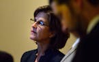 State Auditor Rebecca Otto watched the House proceedings in the hallway outside the chambers as her office was impacted by a surprise piece of legisla