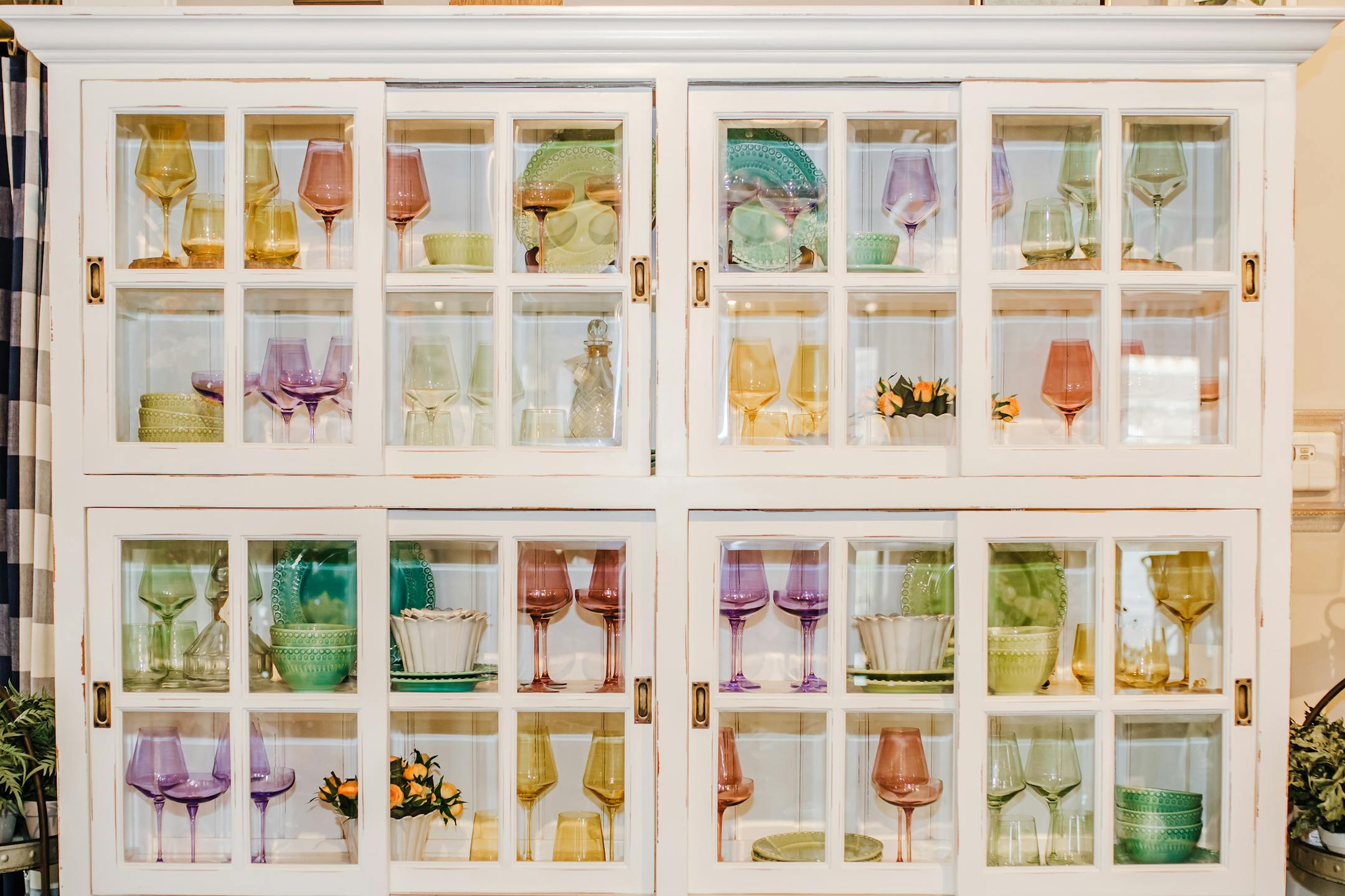 When you are done elevating your tabletops, colorful glassware is the perfect addition to a glass or open-door cabinet display. (Provided photo/TNS)