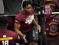 Defensive lineman Boye Mafe got a hand after benching 225 pounds 21 times during the Gophers annual pro day before NFL scouts on March 16.