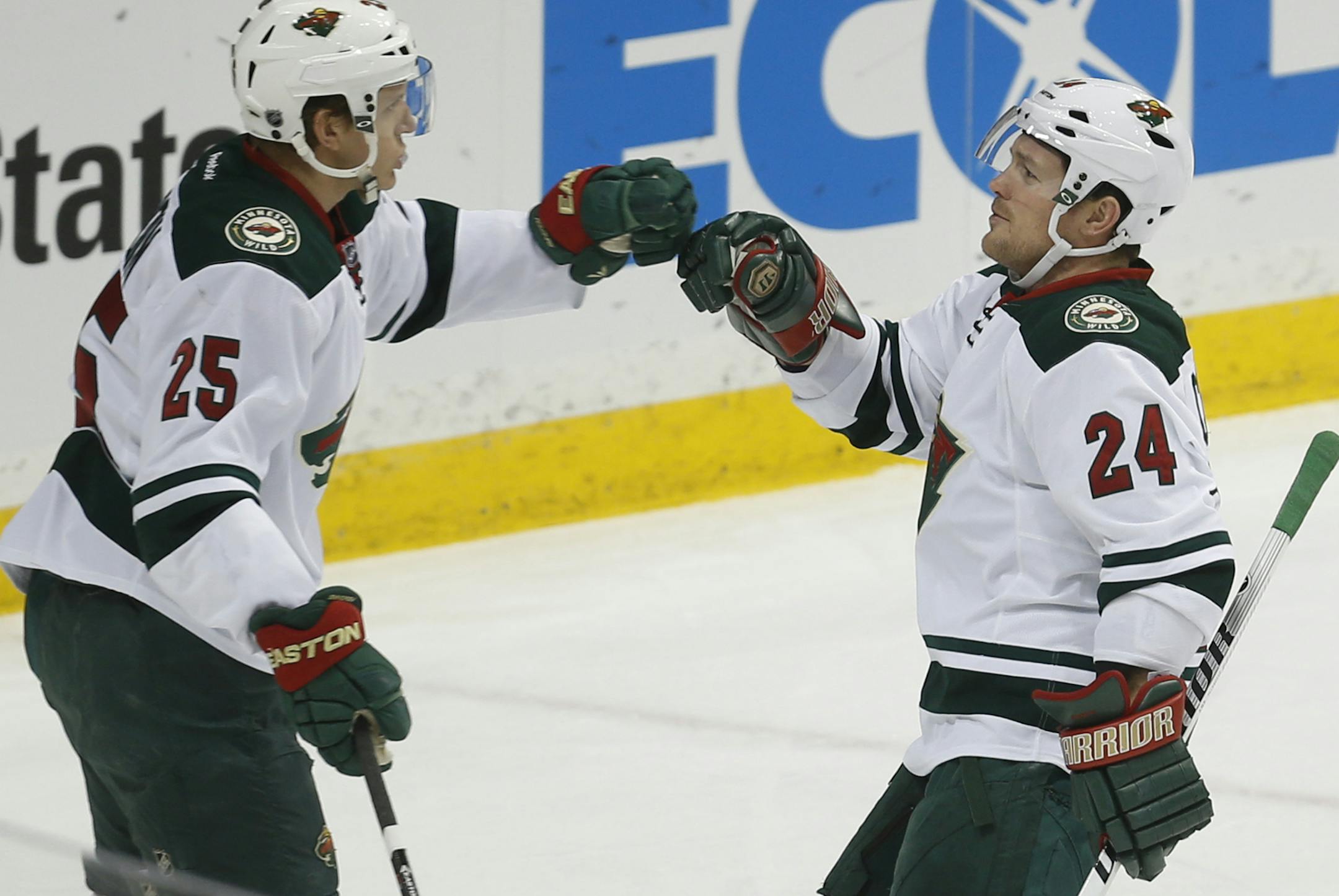 At the Wild game against Nashville, Jonas Brodin(25) and Matt Cooke(24) celebrate the Wild's first goal.]rtsong-taatarii@startribune.com