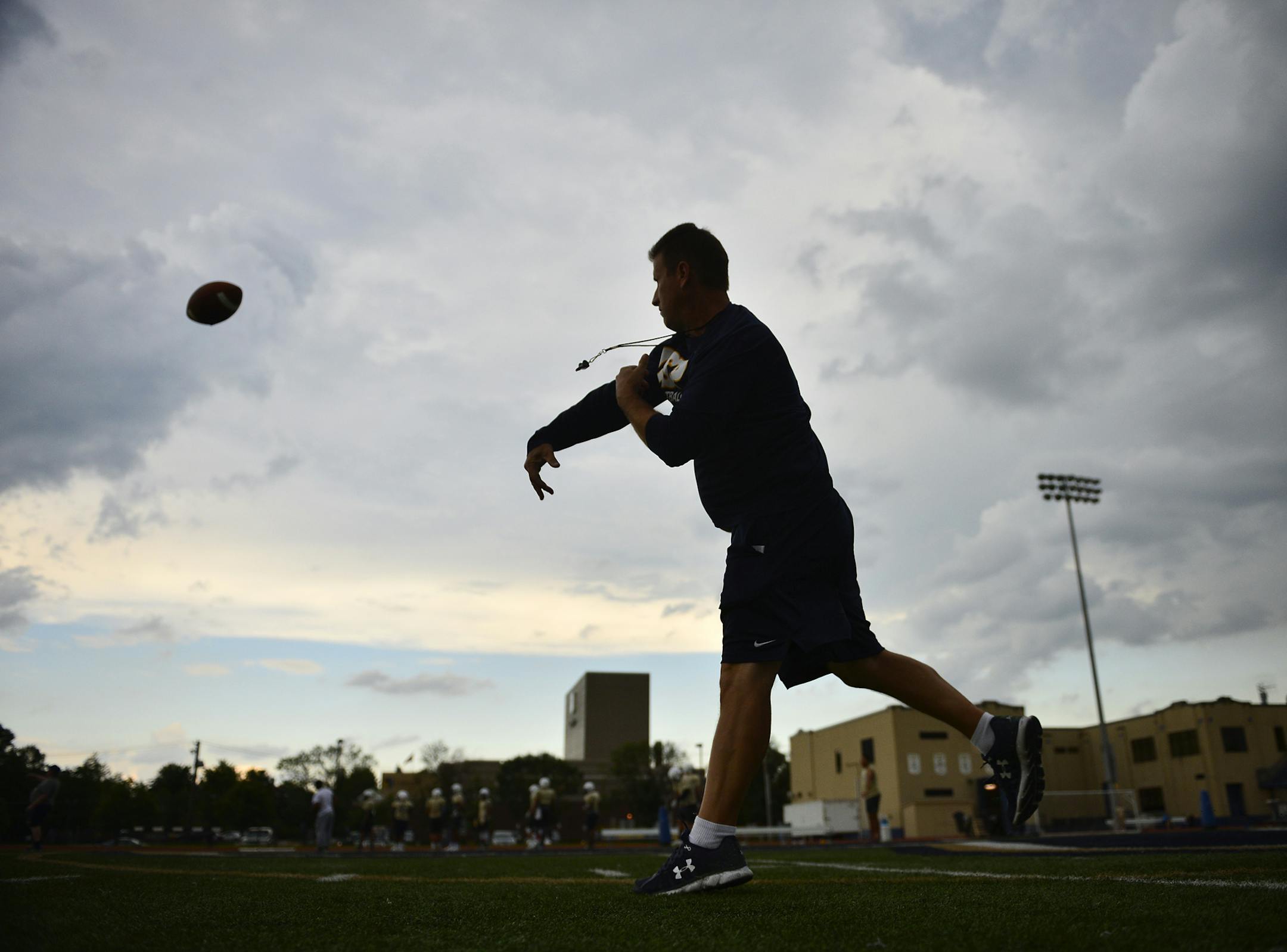 Concordia-St. Paul football head coach Shannon Currier threw the ball while running drills with his tight ends during Tuesday's practice. ] (AARON LAVINSKY/STAR TRIBUNE) aaron.lavinsky@startribune.com Concordia-St. Paul has brought back Shannon Currier as coach. Currier had four winning seasons in as many years at Concordia before moving to Truman State, where he was fired after five years. After working seven years as a sales manager, he's back at Concordia, which was 1-10 a year ago. We photog