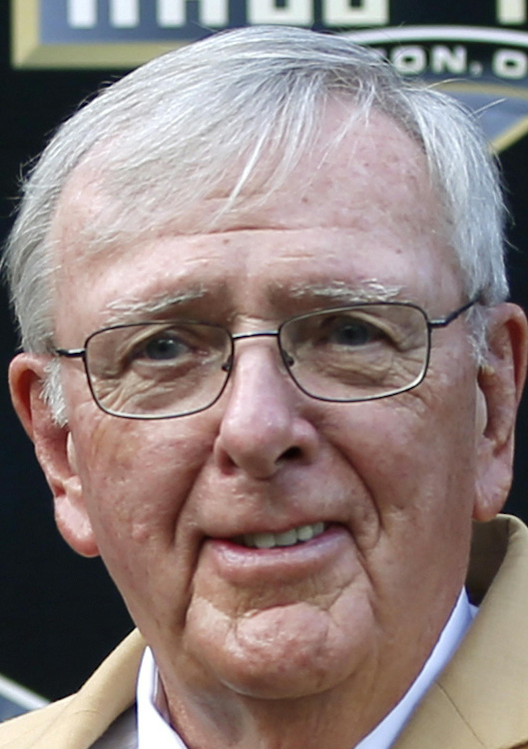 Ron Wolf poses with a bust of himself during an induction ceremony at the Pro Football Hall of Fame Saturday, Aug. 8, 2015, in Canton, Ohio. Wolf, the man who brought Brett Favre to Green Bay, beat the quarterback to Canton. Wolf led off the eight-man Pro Football Hall of Fame Class of 2015 on Saturday night. (AP Photo/Gene J. Puskar)