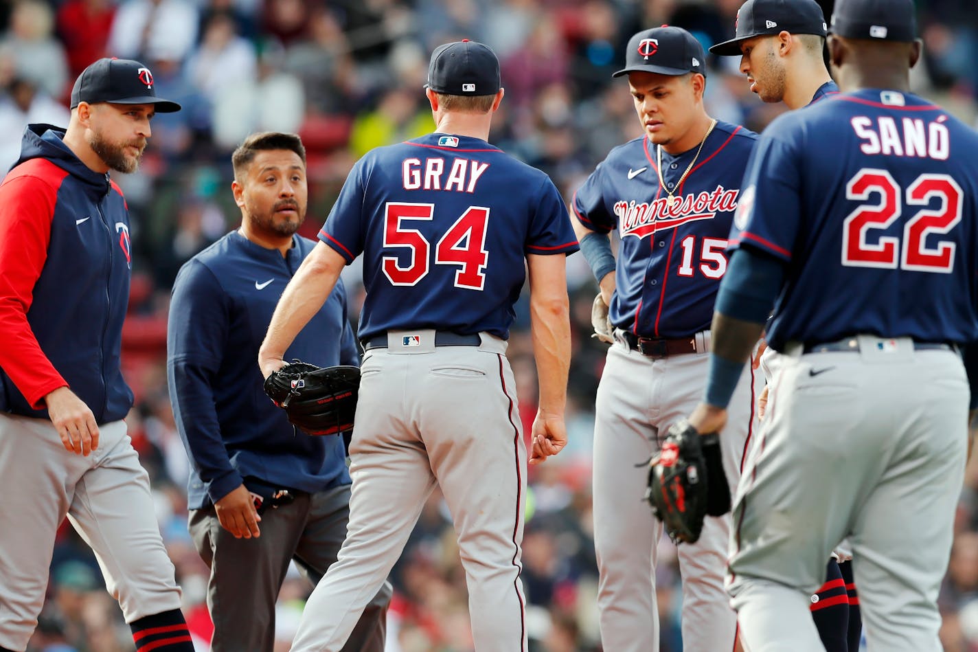 Twins manager Rocco Baldelli, left, comes to the mound with a trainer to talk with Sonny Gray during the second inning Saturday in Boston. Gray left the game.