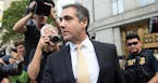 President Donald Trump's longtime personal lawyer, Michael Cohen, leaves New York Federal Court after making a plea deal on Tuesday, Aug. 21, 2018. Co