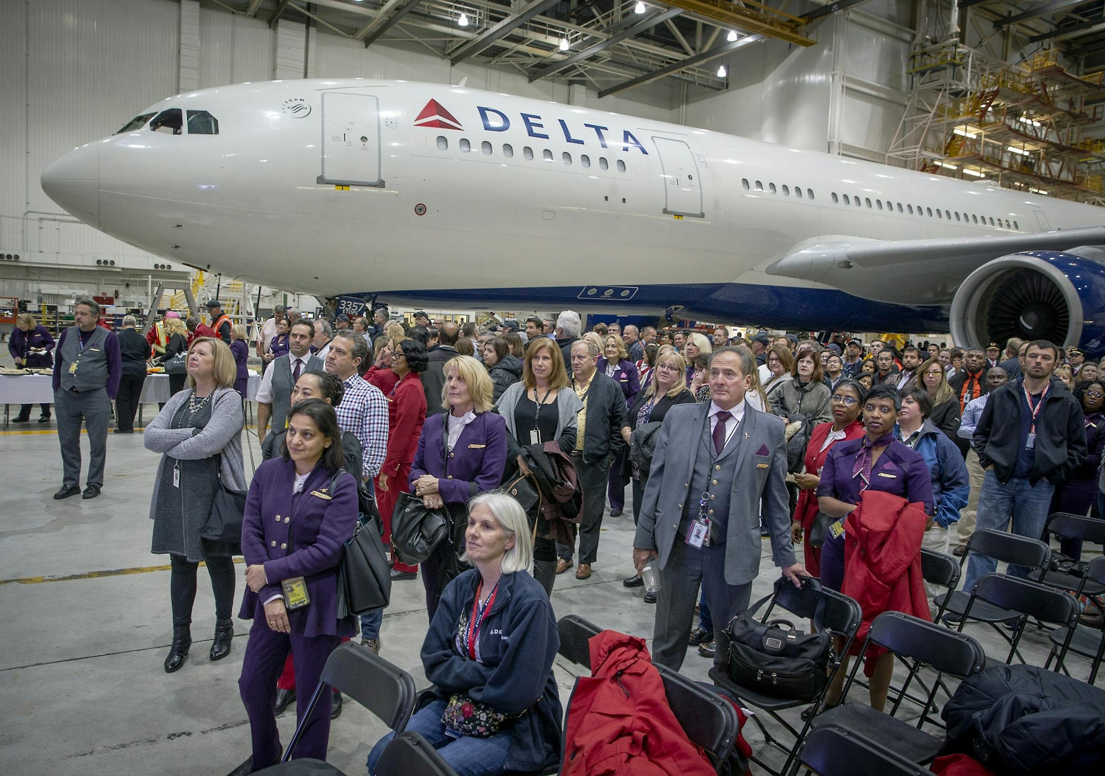 Delta Air Lines employees watched a live feed as the Atlanta hub showed off its new plane, as they celebrated its 10-year anniversary of the Northwest merger (the U.S. DOJ officially approved the merger Oct. 29, 2008) during a party at the MSP hangar, Monday, October 29, 2018 in Bloomington, MN. About 600 employees showed up for a live stream connecting Minneapolis and Atlanta hangar parties through a large screen led by CEO of Delta Air Lines, Ed Bastian in Atlanta.