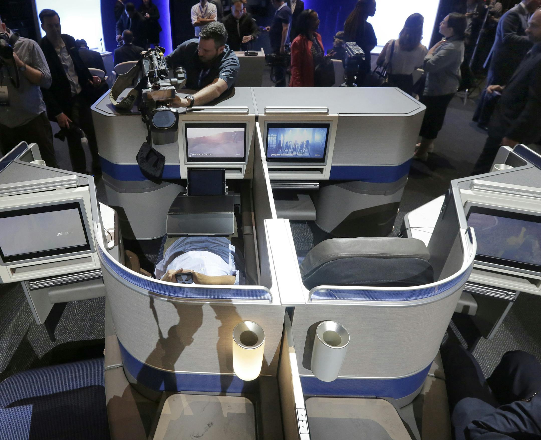 United Airlines' new Polaris service seating configuration, to become available on trans-Atlantic flights, is displayed during a presentation in New York, Thursday, June 2, 2016. (AP Photo/Richard Drew)