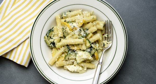 All the ingredients for a perfect pasta dish: Fresh ricotta and Parmesan, zucchini and pesto.
