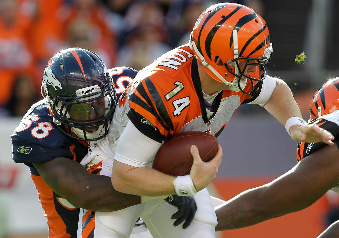 Denver Broncos outside linebacker Von Miller (58) sacks Cincinnati Bengals quarterback Andy Dalton (14) in the fourth quarter of an NFL football game on Sunday, Sept. 18, 2011, in Denver. (AP Photo/Joe Mahoney)