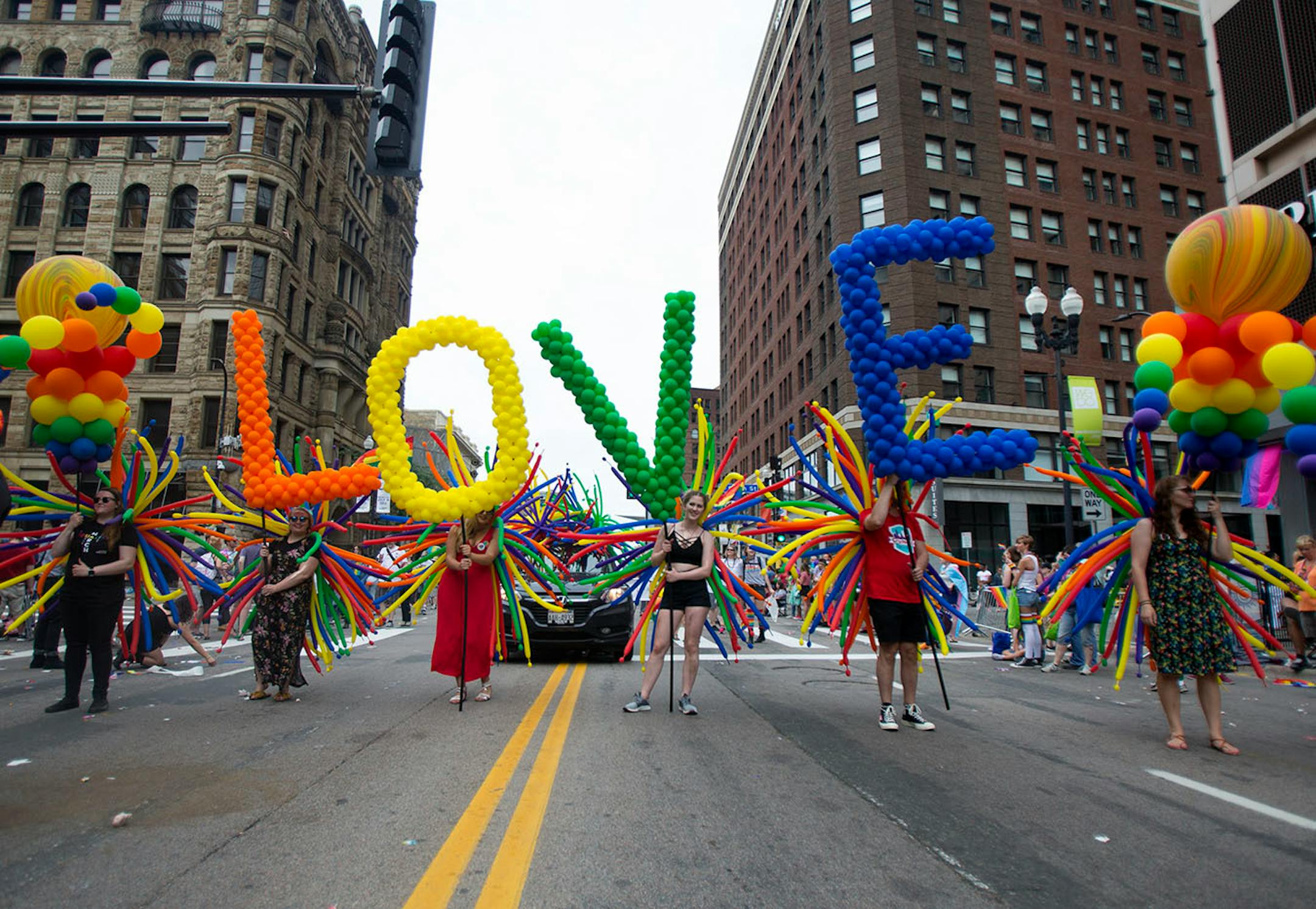 CityPages marched down Hennepin with balloons spelling out the word "LOVE" at the pride parade, Sunday, June 24 2018.