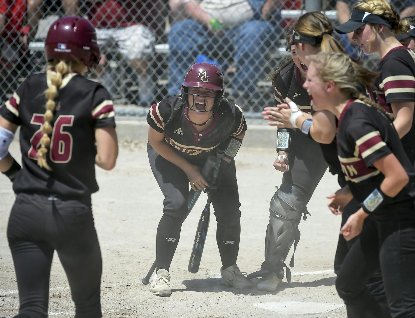 Teammates celebrated at the plate after Maple Grove pitcher Ava Dueck (26) hit a home run against Stillwater in the bottom of the first inning. ] Aaron Lavinsky &#xa5; aaron.lavinsky@startribune.com Stillwater played Maple Grove in the Class 4A softball state tournament championship game on Friday, June 7, 2019 at Caswell Park in North Mankato, Minn. Maple Grove beat Stillwater 3-2.