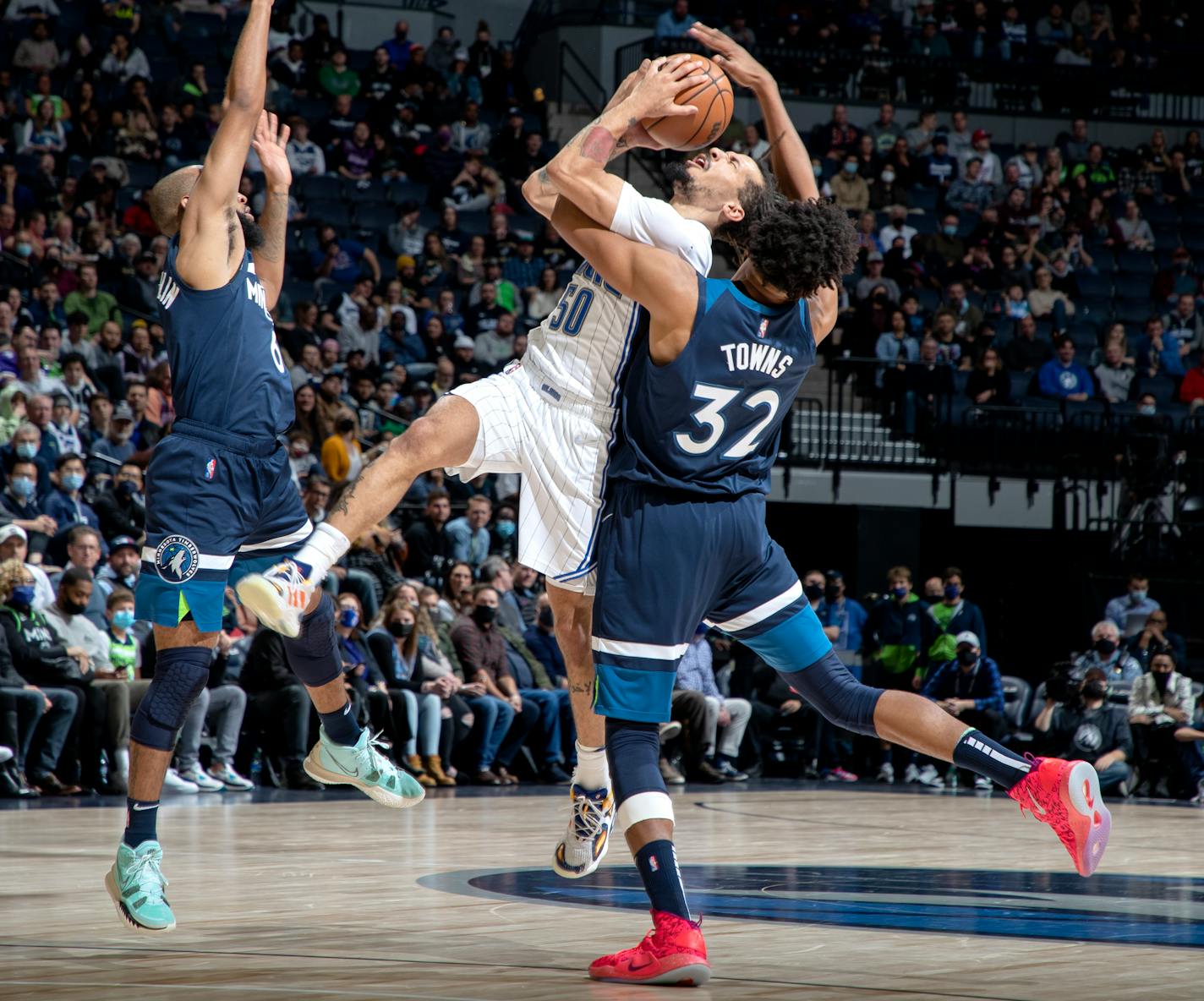 Cole Anthony (50) of the Orlando Magic is defended by Karl Anthony-Towns (32) of the Minnesota Timberwolves in the second quarter, Monday, Nov. 1 at Target Center in Minneapolis, Minn. The Minnesota Timberwolves hosted the Orlando Magic at Target Center. ] CARLOS GONZALEZ • cgonzalez@startribune.com