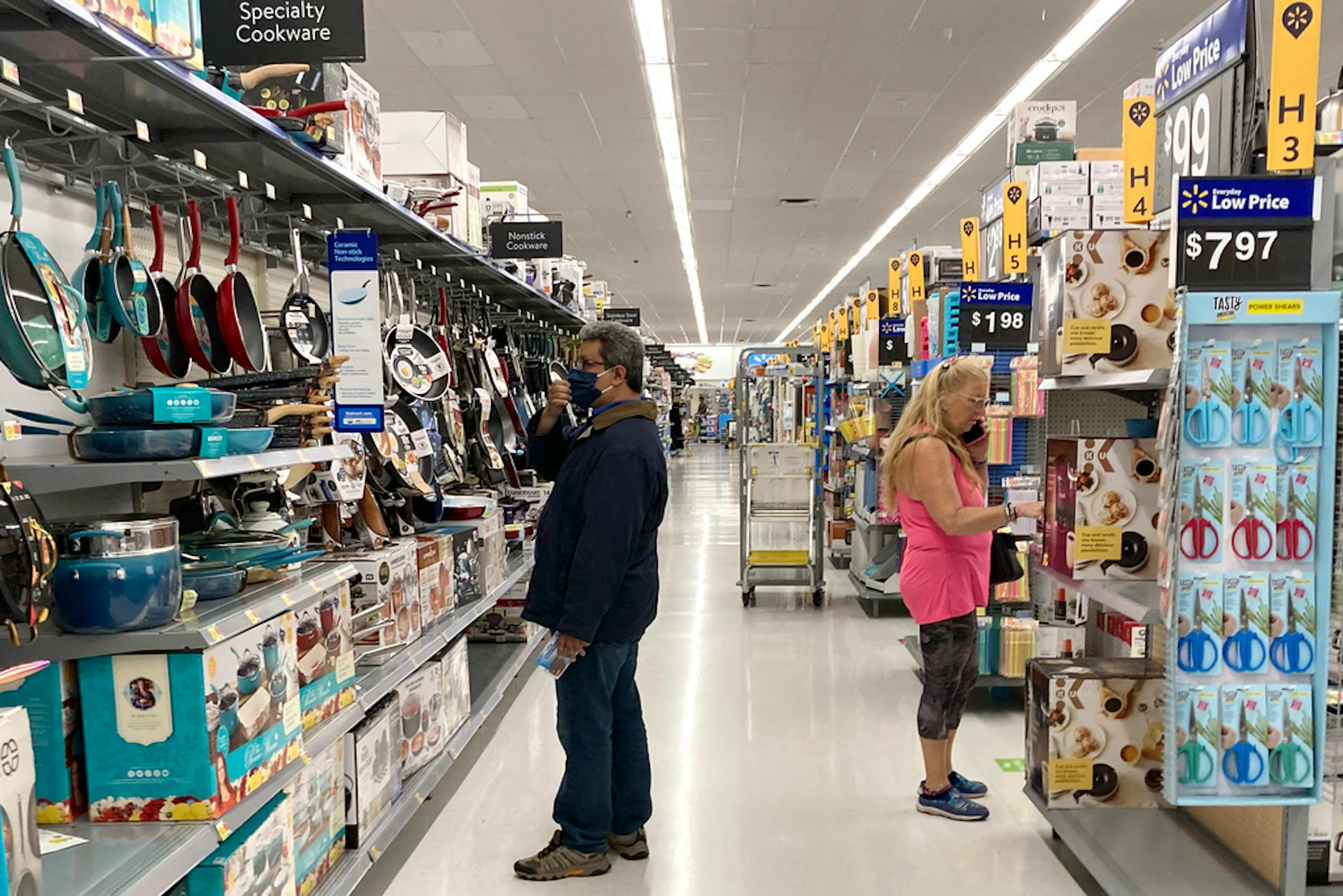 FILE - Consumers shop at a Walmart store in Vernon Hills, Ill., Sunday, May 23, 2021. U.S. consumer confidence fell in August to the lowest level since February amid rising concerns about the rapidly spreading delta variant of the coronavirus and worries about higher inflation. The Conference Board reported Tuesday, Aug. 31, 2021 that its consumer confidence index dropped to a reading of 113.8 in August, down from a revised 125.1 in July. (AP Photo/Nam Y. Huh, file)
