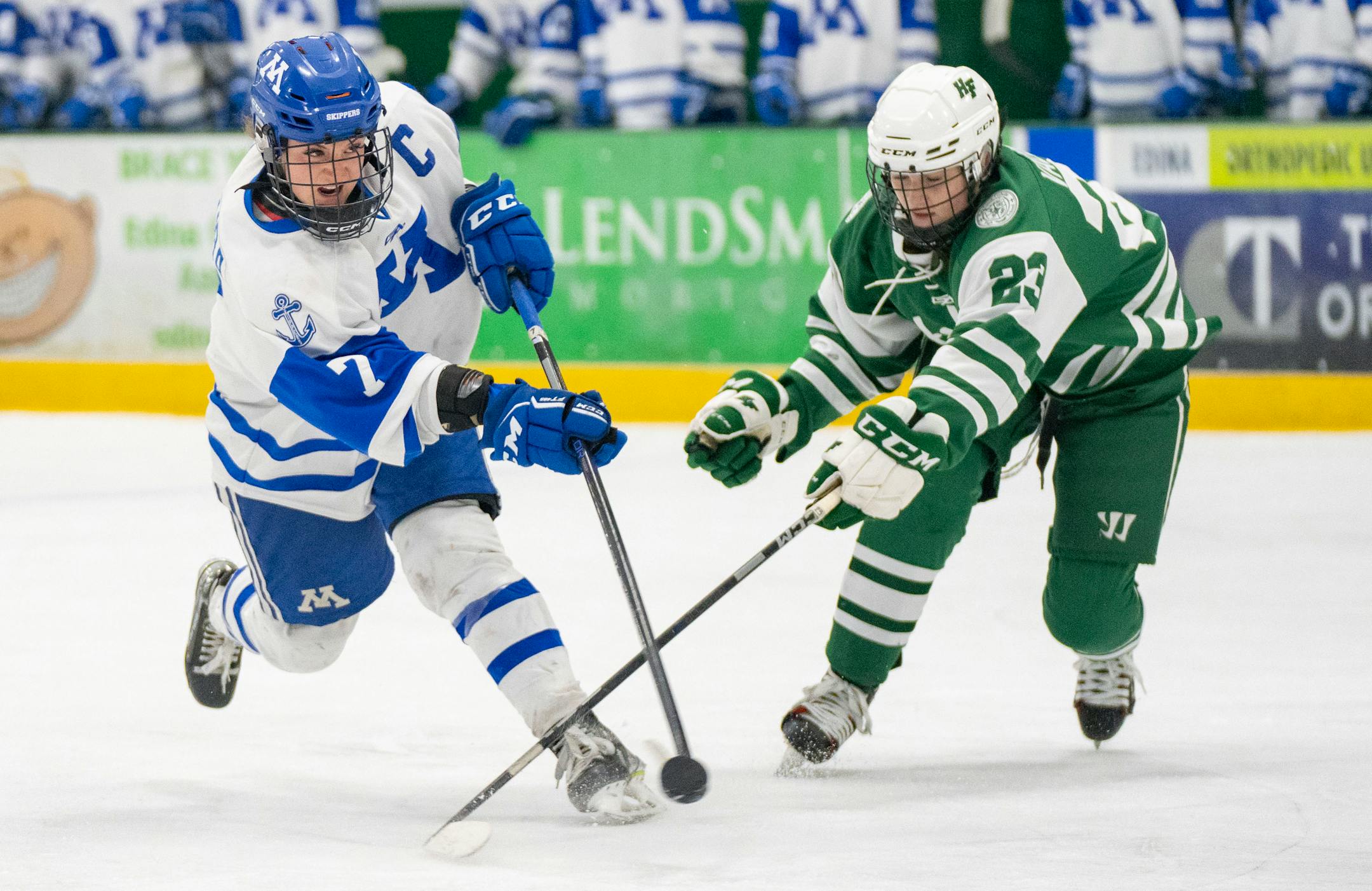 Minnetonka forward Grace Sadura (7) takes a shot in front of Holy Family defender Justina Valentini (23) during the second period.