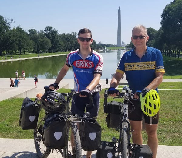 Dorian Grilley, executive director of Bicycle Alliance of Minnesota, right, with his son, Davis, in Washington, D.C. The two made their way from Mahto
