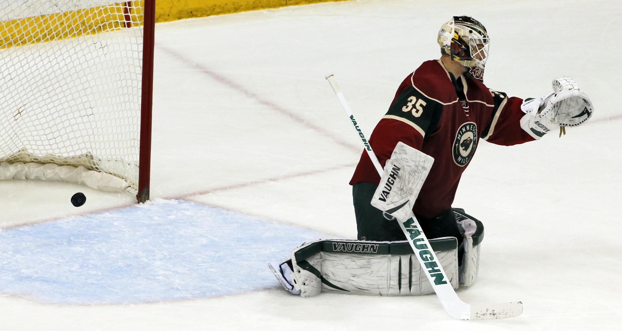 The puck flew past Wild goalie Darcy Kuemper for a Vancouver goal in 2nde period action.