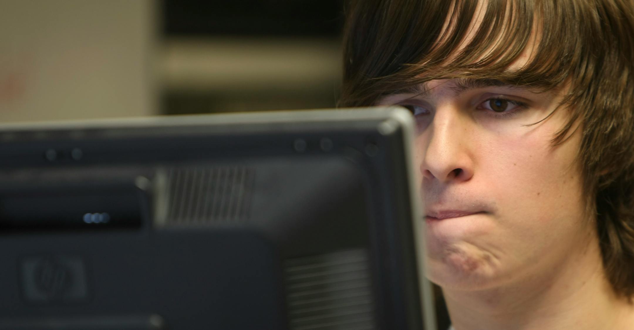 Burnsville High School Stock Market Game member Kevin Phyle gave his team's fantasy $100,000 stock picks another going over. They posted gains in the current volatile market.