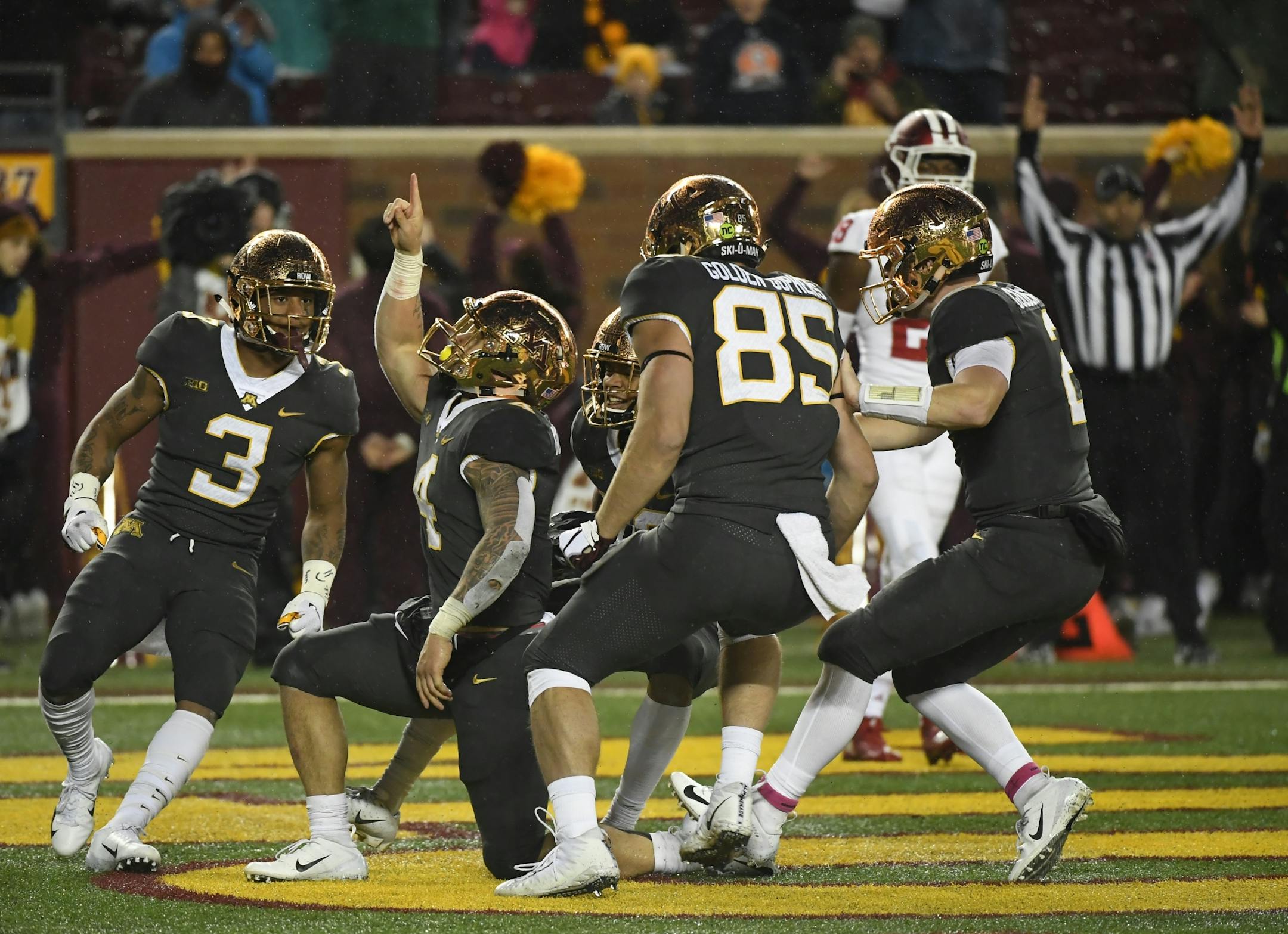 Teammates celebrated with running back Shannon Brooks (4) after his third quarter rushing touchdown Friday night against the Indiana Hoosiers.