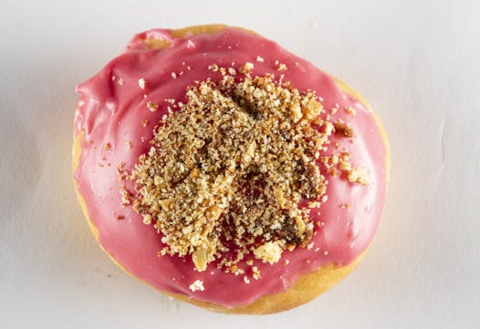 Cream cheese-filled doughnut with raspberry icing from Sleepy V’s.