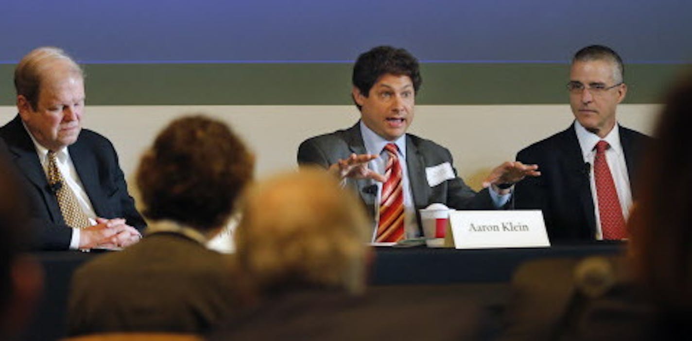 At the Federal Bank building in Minneapolis where a banking symposium on reforms and ending "too big to fail" took place, Aaron Klein(center) addressed the topic with the audience.] Richard Tsong-Taatarii/rtsong-taatarii@startribune.com