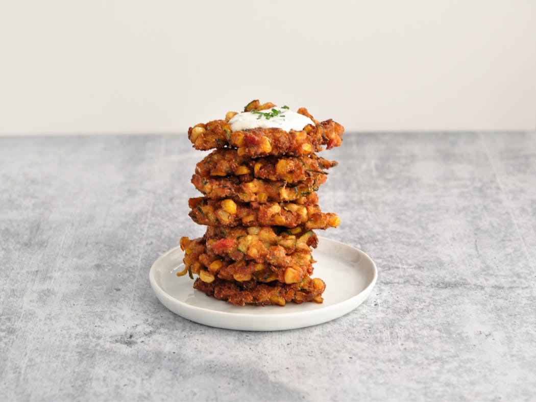 No matter how you stack them, Corn and Zucchini Fritters are good any time of day. 