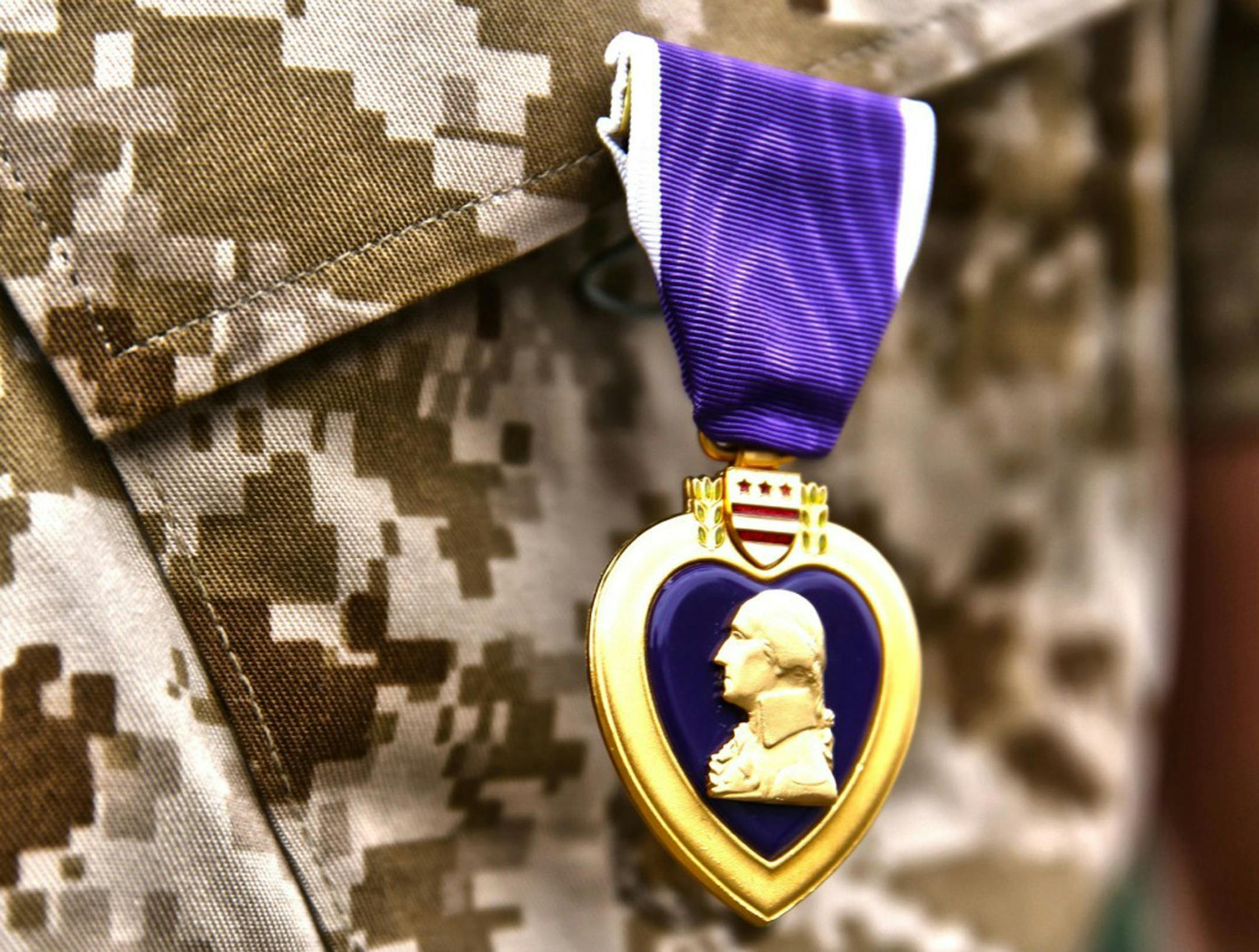 A Purple Heart award is shown here on a Marine Corps uniform. Purple Hearts are in question following the Chattanooga attack. Illustrates PURPLEHEART (category a) by Dan Lamothe © 2015, The Washington Post. Moved Friday, July 31, 2015. (MUST CREDIT: (U.S. Marine Corps photo by Cpl. Timothy Childers)