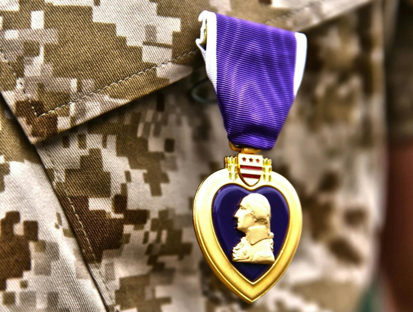 A Purple Heart award is shown here on a Marine Corps uniform. Purple Hearts are in question following the Chattanooga attack. Illustrates PURPLEHEART (category a) by Dan Lamothe &#xa9; 2015, The Washington Post. Moved Friday, July 31, 2015. (MUST CREDIT: (U.S. Marine Corps photo by Cpl. Timothy Childers)