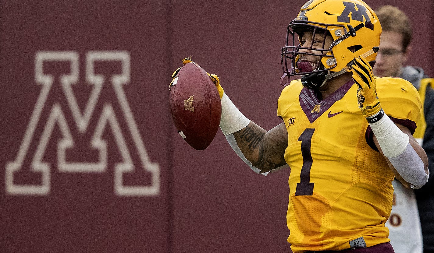 Rodney Smith (1) celebrated after scoring a touchdown during the spring game.