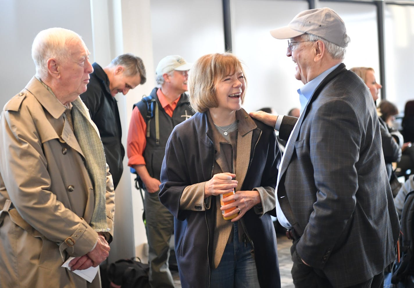 Tina Smith greeted Vice President Walter Mondale at MSP Airport on the way to D.C. for her swearing-in. On the left is Smith's father.