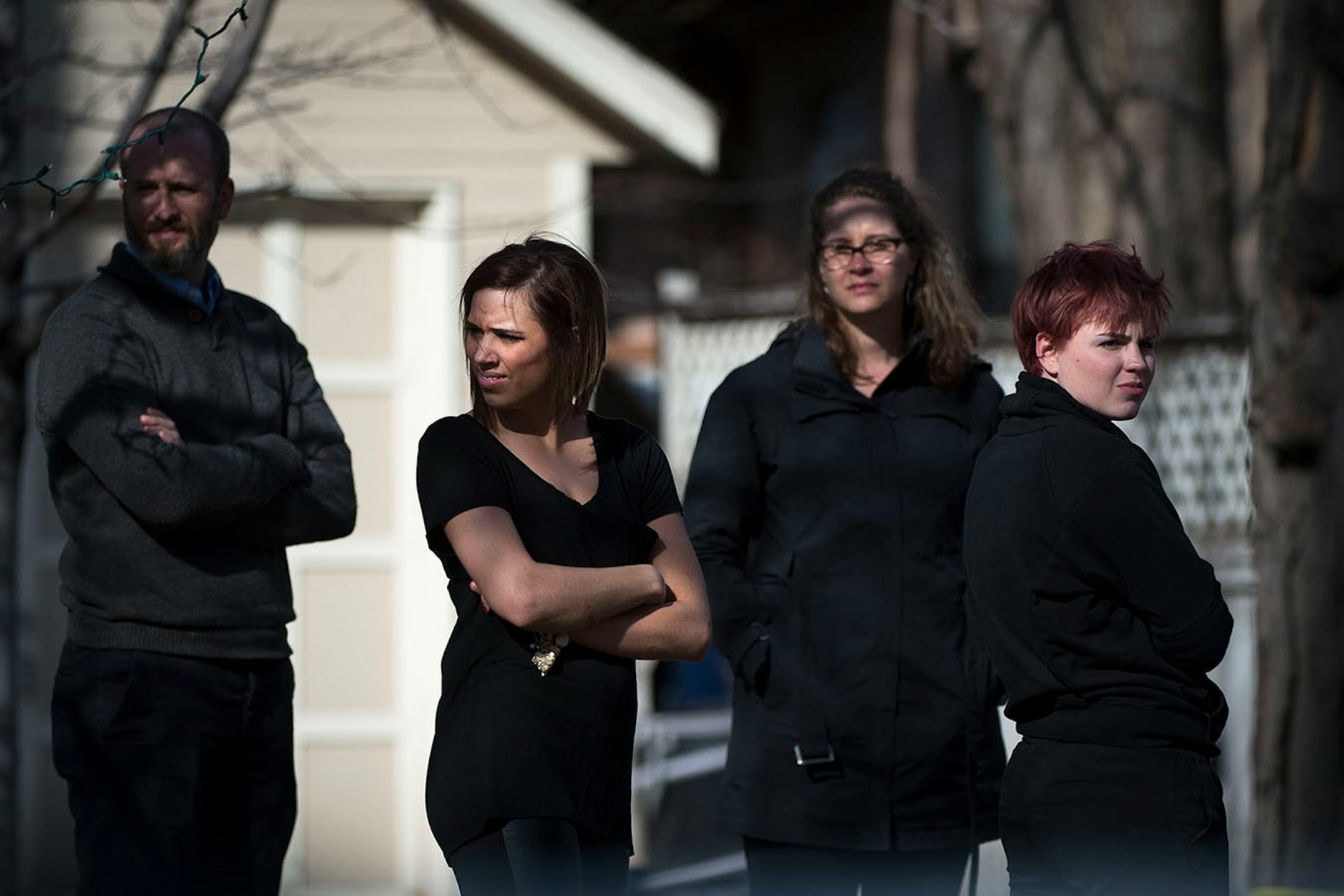 Bystanders stand behind the police lines while watching a hazardous material situation unfold in the Marcy Holmes neighborhood of Minneapolis on the 500 block of 6th Street Southeast on Friday, April 10, 2015.