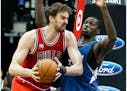 Chicago Bulls' Pau Gasol, left, of Spain, tries to work around Minnesota Timberwolves' Gorgui Dieng of Senegal in the second half of an NBA basketball