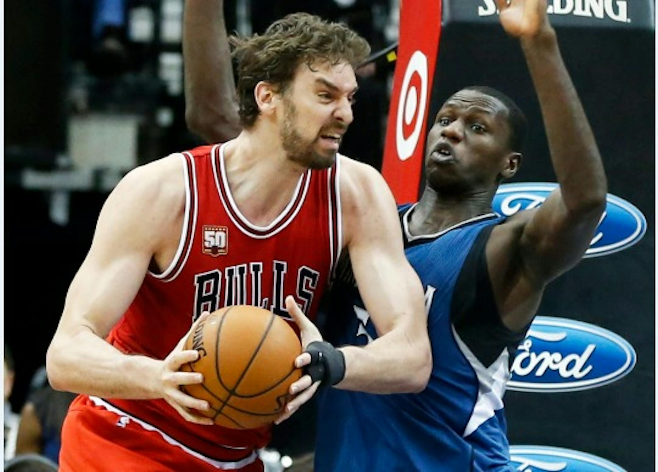 Chicago Bulls' Pau Gasol, left, of Spain, tries to work around Minnesota Timberwolves' Gorgui Dieng of Senegal in the second half of an NBA basketball game, Saturday, Feb. 6, 2016, in Minneapolis. The Timberwolves won 112-105. Gasol led the Bulls with 25 points while Dieng scored 24 for the Timberwolves. (AP Photo/Jim Mone) ORG XMIT: MNJM110