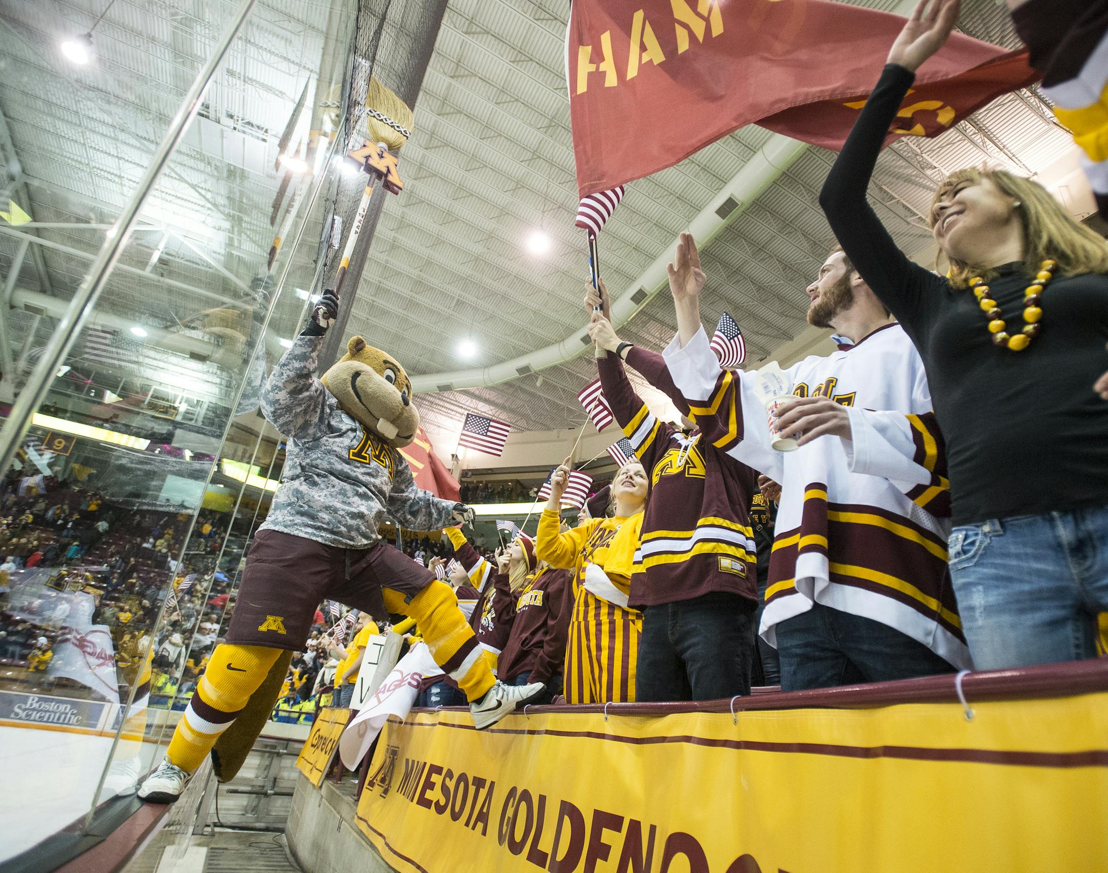 Goldy Gopher celebrated with the student section after Minnesota defeated Michigan State 3-1 to complete the sweep Saturday night. ] (AARON LAVINSKY/STAR TRIBUNE) aaron.lavinsky@startribune.com The University of Minnesota Golden Gophers mens' hockey team played the Michigan State University Spartans on Saturday, Jan. 16, 2016 at Mariucci Arena in Minneapolis, Minn.