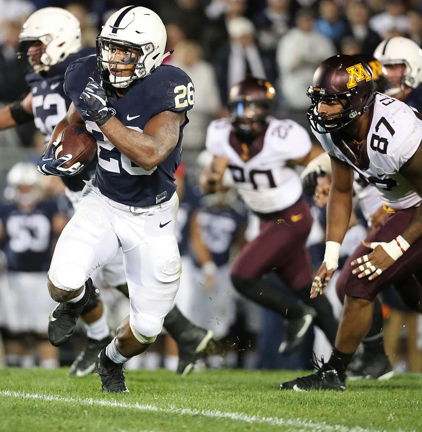 Penn State's running back Saquon Barkley broke away from Minnesota's defensive lineman Gaelin Elmore to score the winning touchdown beating Minnesota 29-23 in overtime at Beaver Stadium, Saturday, October 1, 2016 in State College, PA. ] (ELIZABETH FLORES/STAR TRIBUNE) ELIZABETH FLORES &#x2022; eflores@startribune.com