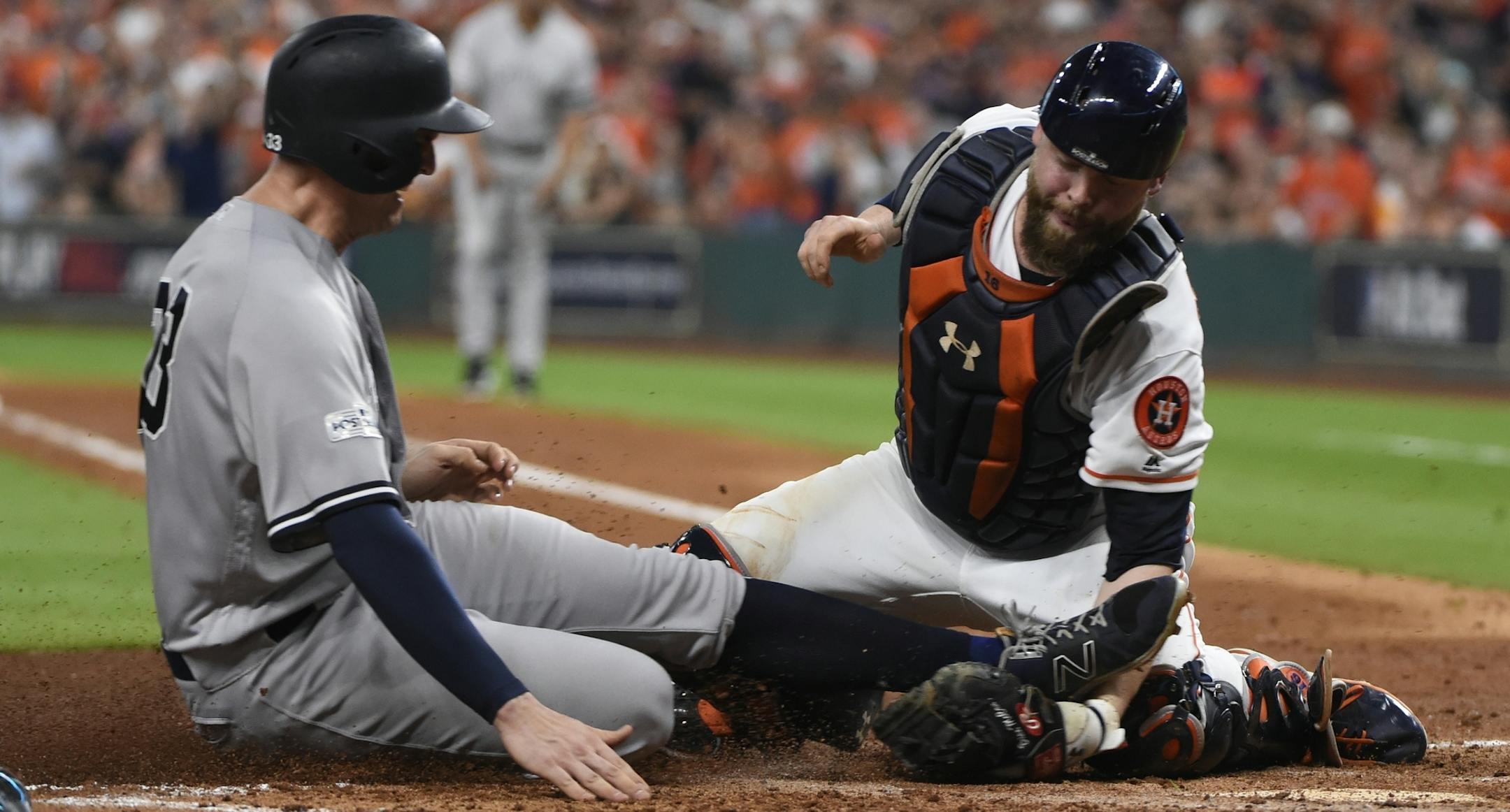 Houston Astros catcher Brian McCann tags out New York Yankees' Greg Bird at home during the fifth inning of Game 7 of baseball's American League Championship Series Saturday, Oct. 21, 2017, in Houston. (AP Photo/Eric Christian Smith)