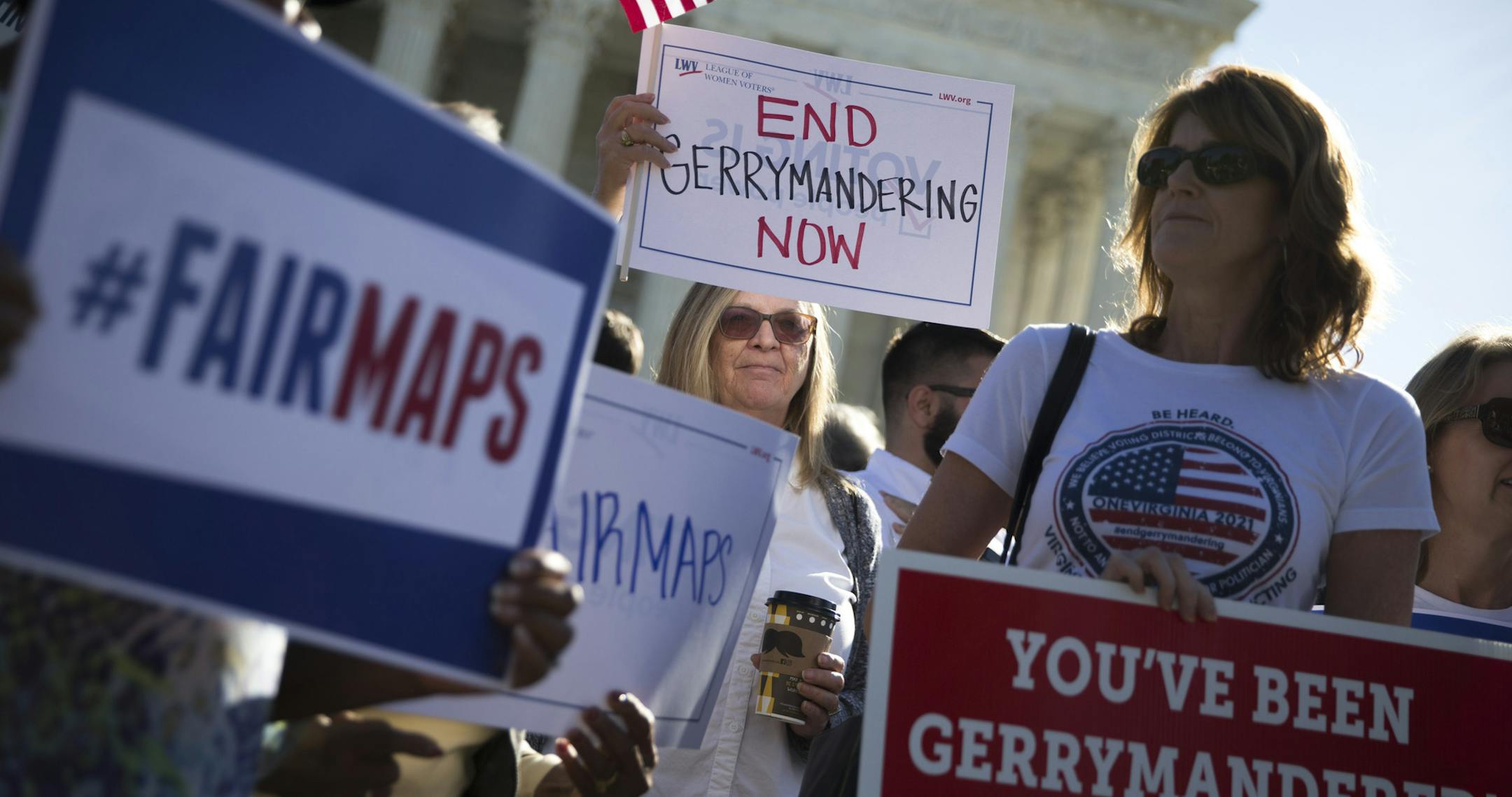 FILE -- Demonstrators outside the Supreme Court building as justices heard arguments in a key gerrymandering case, on Capitol Hill in Washington, Oct. 3, 2017. The court has agreed to take another look at whether the Constitution bars extreme partisan gerrymandering, though experts said the seating of Justice Brett Kavanaugh makes a ruling limiting the practice less likely. (Tom Brenner/The New York Times)
