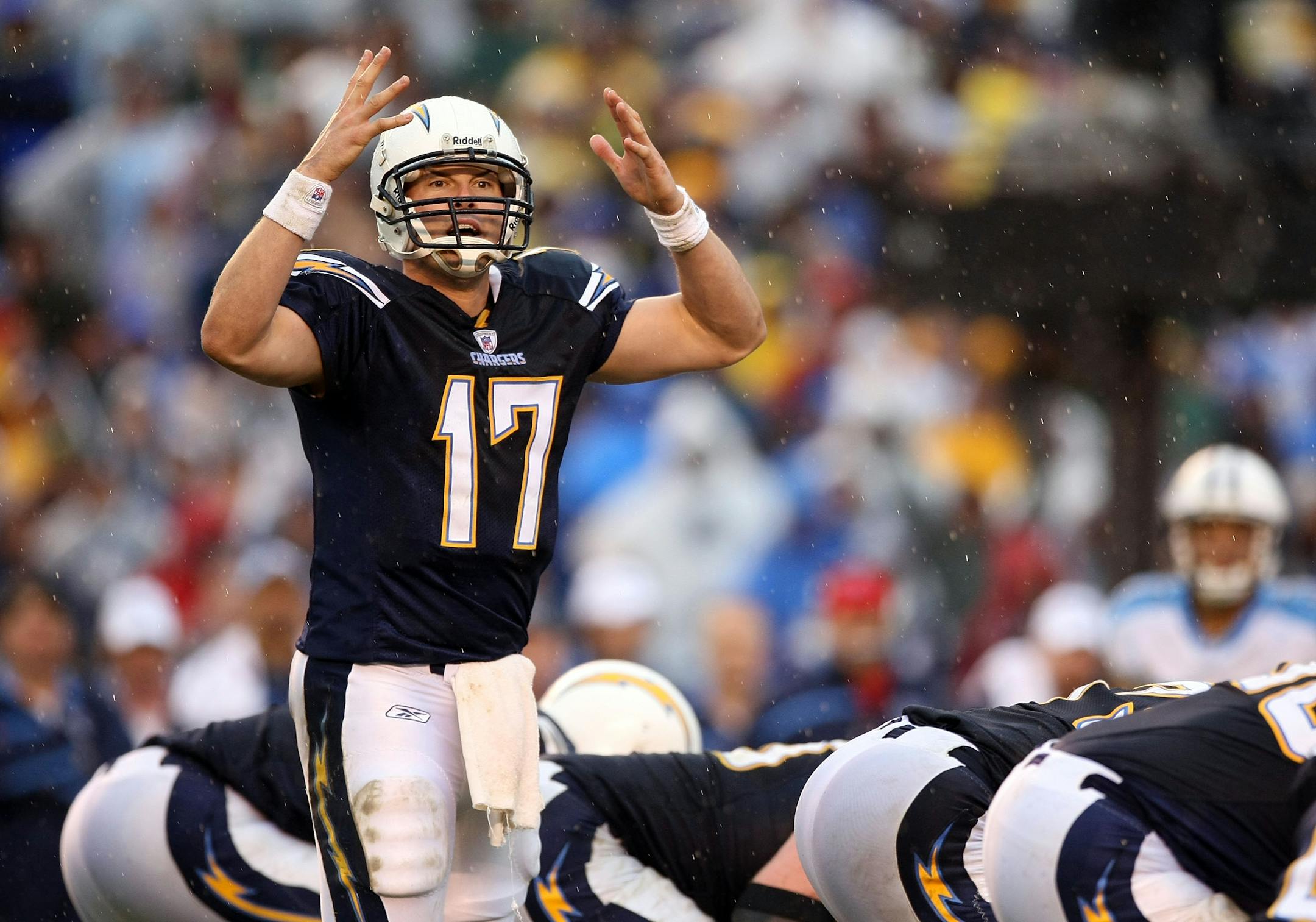 San Diego quarterback Philip Rivers signaled from the line of scrimmage during the Chargers' 17-6 victory Sunday against Tennessee. Rivers stepped up his game once it became obvious the Titans were shutting down LaDainian Tomlinson and the running game. Quarterback rescues were a trend all wild-card weekend.