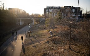 The Soo Line Garden is situated next to the Midtown Greenway bike path.
