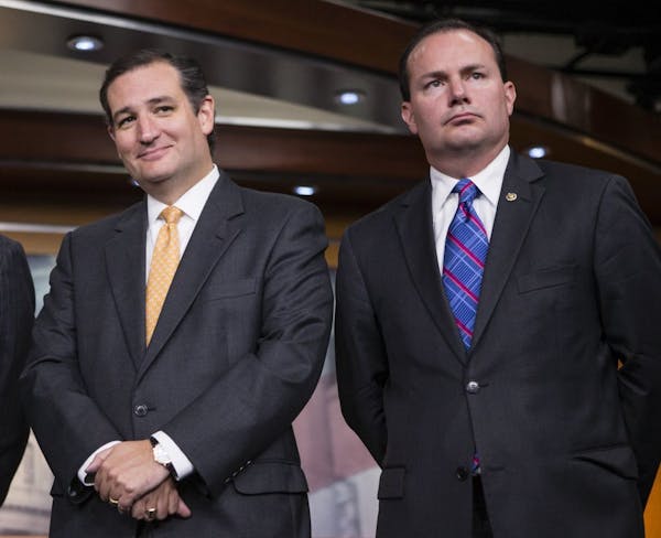 Sen. Ted Cruz, R-Texas, left, and Sen. Mike Lee, R-Utah, during a news conference with conservative Congressional Republicans at the Capitol in Washin