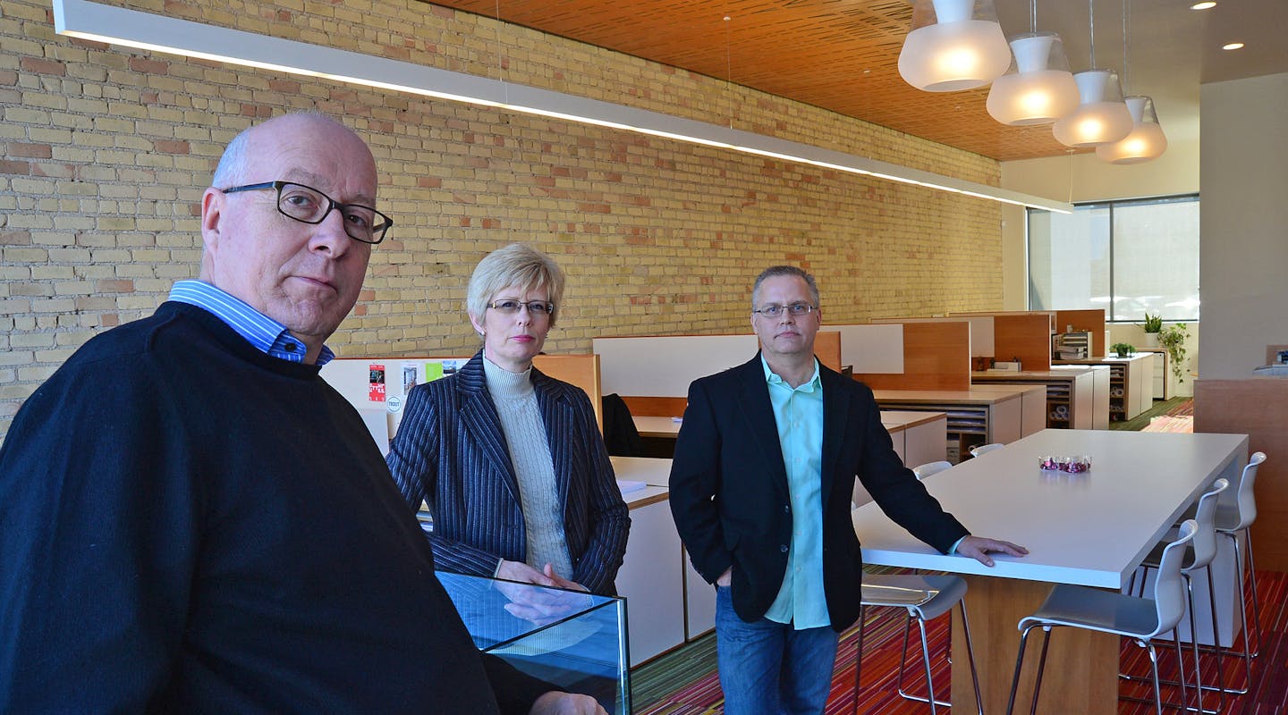 292 Design Group partners Mark Wentzell, Pam Anderson and Tom Betti stand in their Lake street office bathed in the light from a window wall. The location was a former massage parlor which had become a vacant storefront.] Richard.Sennott@startribune.com Richard Sennott/Star Tribune Minneapolis Minn. Wednesday 1/8/2014) ** (cq)