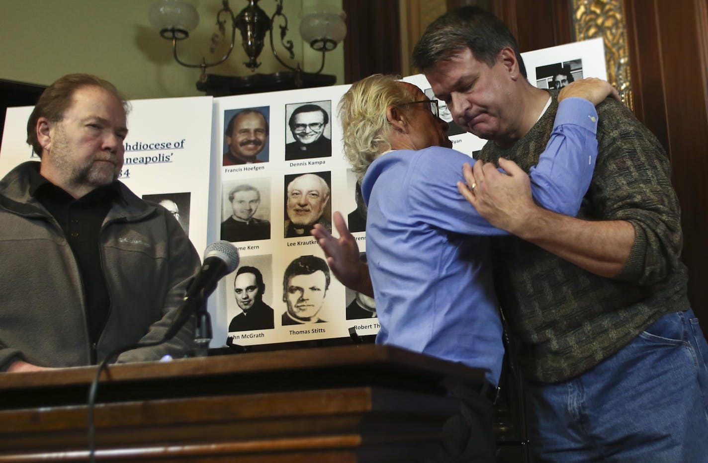 Attorney Jeff Anderson gave Al Michaud a hug after he and three other victims of priest abuse spoke at a press conference in response to the Archdiocese releasing a list of clergy who have been credibly accused of sexually abusing minors on Thursday, December 5, 2013, in St. Paul, Minn. ] At left is David Pususta and at right is James Heutmaker RENEE JONES SCHNEIDER &#x2022; reneejones@startribune.com