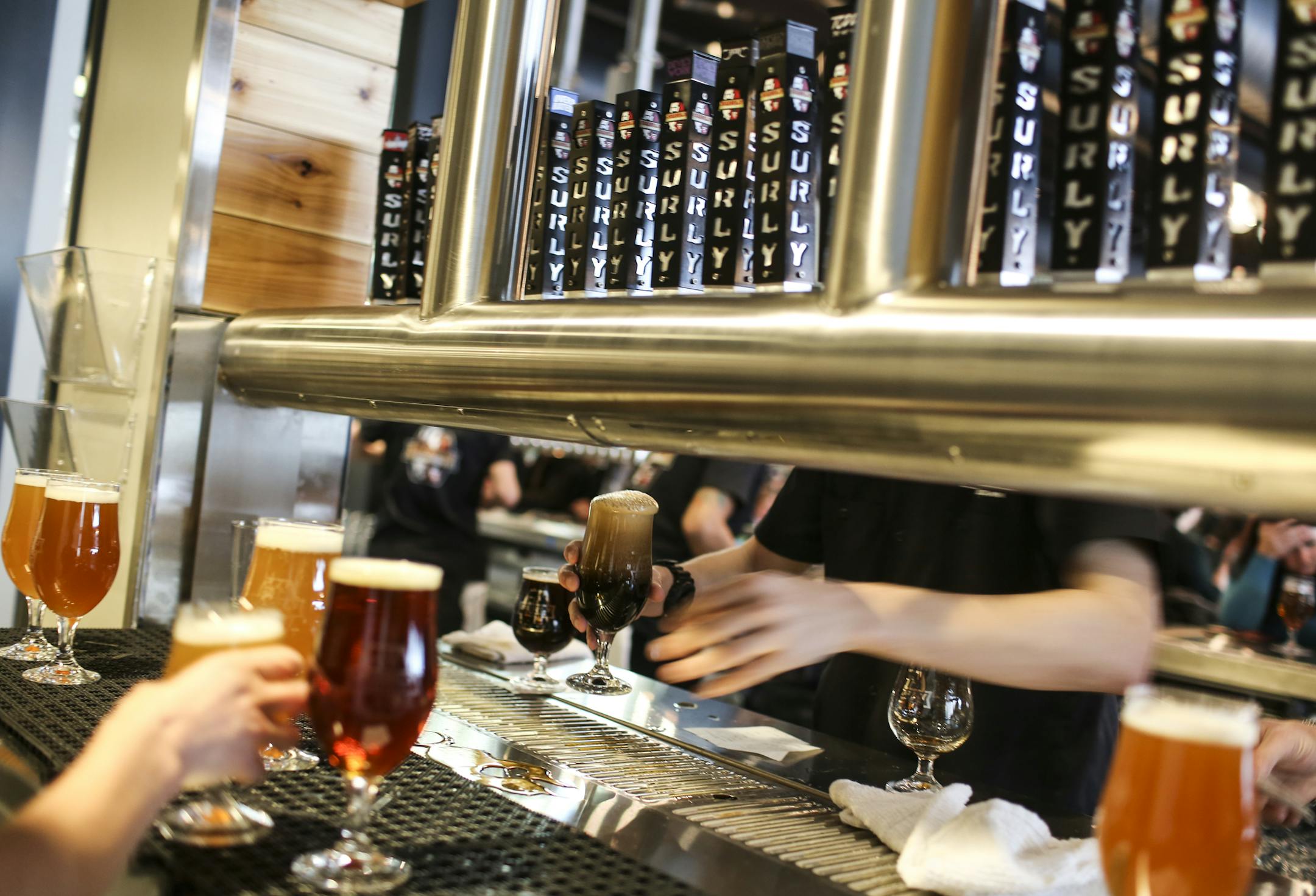 Beers being poured at the Surly brew-pub tap room public grand opening in Minneapolis, Minn. on Friday, December 19, 2014. ] RENÉE JONES SCHNEIDER reneejones@startribune.com
