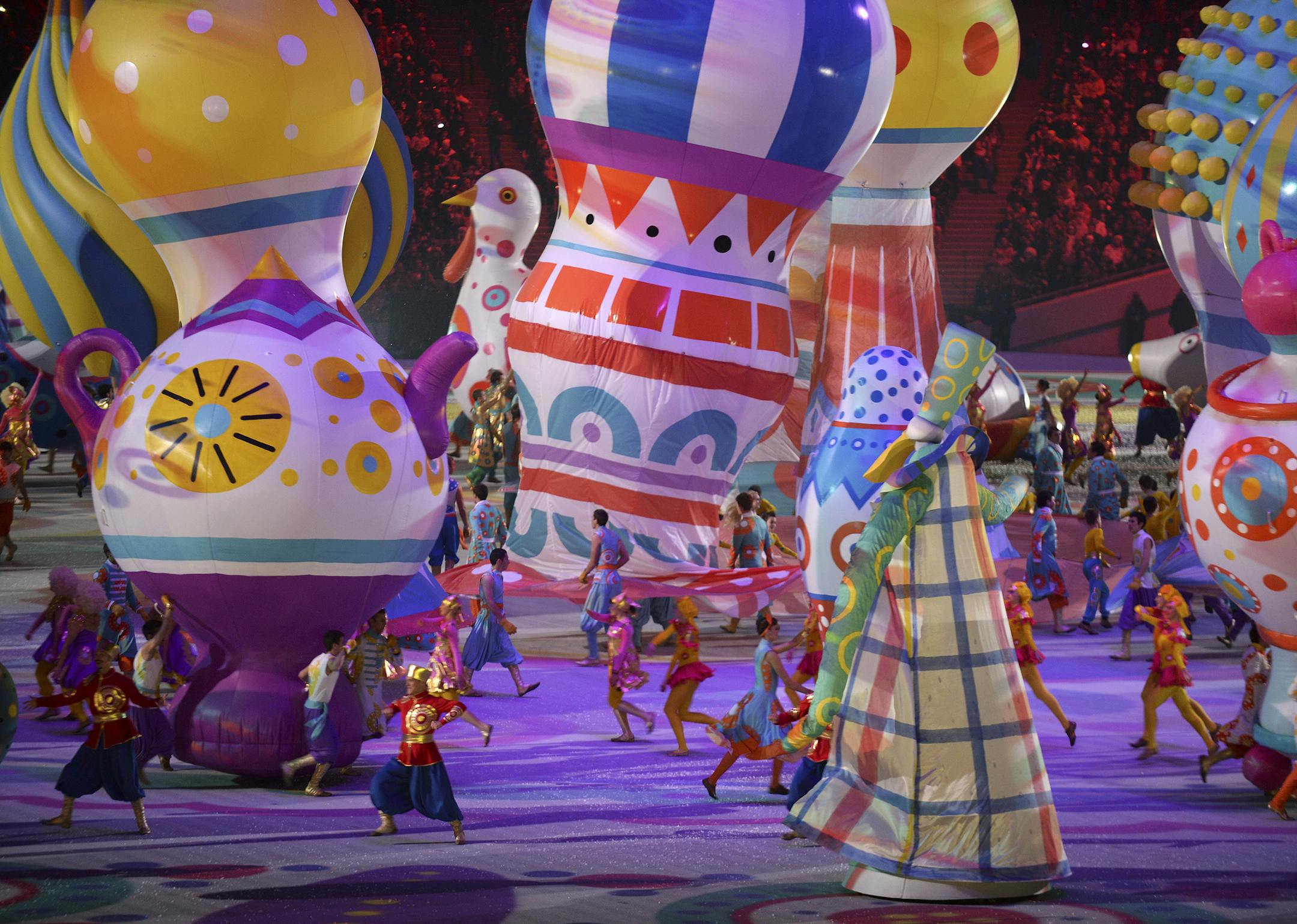 Dancers move balloons around as they inflate to take the shape of St. Basil's Cathedral on Red Square in Moscow during the opening ceremony of the 2014 Olympic Winter Games at Fisht Olympic Stadium in Sochi, Russia, Feb. 7, 2014. (James Hill/The New York Times) -- NO SALES