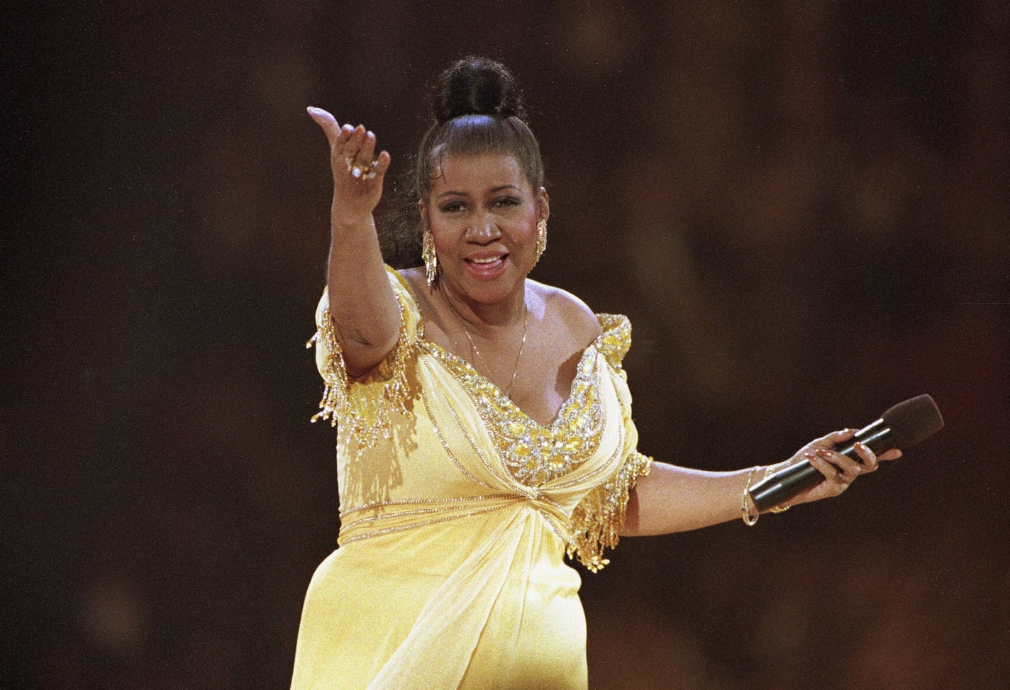 FILE - In this Jan. 19, 1993 file photo, singer Aretha Franklin performs at the inaugural gala for President Bill Clinton in Washington. Franklin died on Aug. 16, 2018, at her home in Detroit. She was 76. Public viewings are planned Tuesday and Wednesday at the Charles H. Wright Museum of African American History, which is also where civil rights icon Rosa Parks lay in repose after her 2005 death.