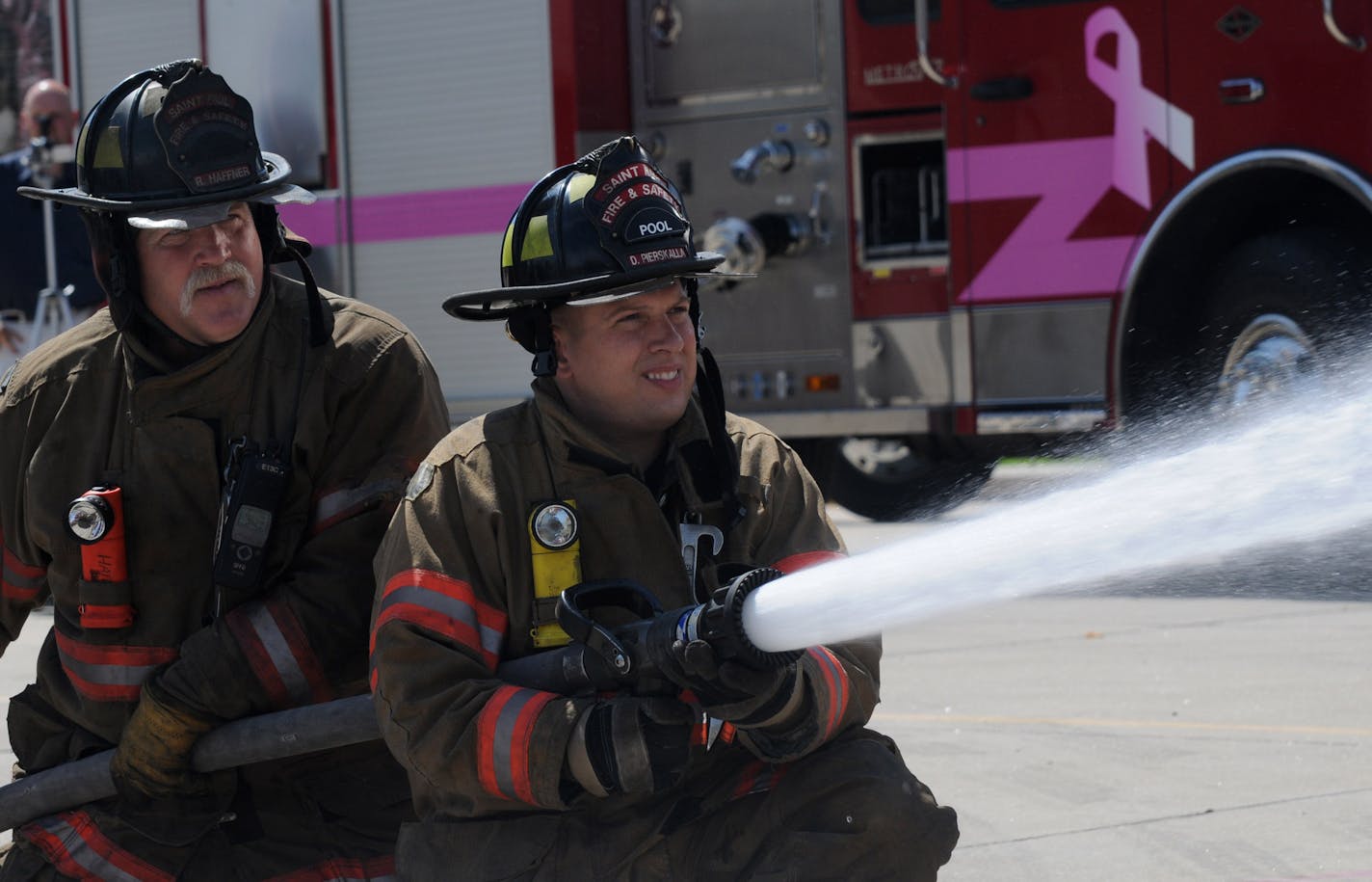 Turns out St. Paul had 6 fire trucks locally built just for the RNC, with special foam/ fire protection injection systems built in by Golden Valley based Pentair. Trucks were bult built with federal and RNC money and cost $2.5 million. In this Picture ; from l to r St Paul firefighters Robin Haffner and Dan Pierskalla spray some foam ,while training on a new Foam/fire protection injection system.This new injection systemwas built by Golden Valley based Pentair .