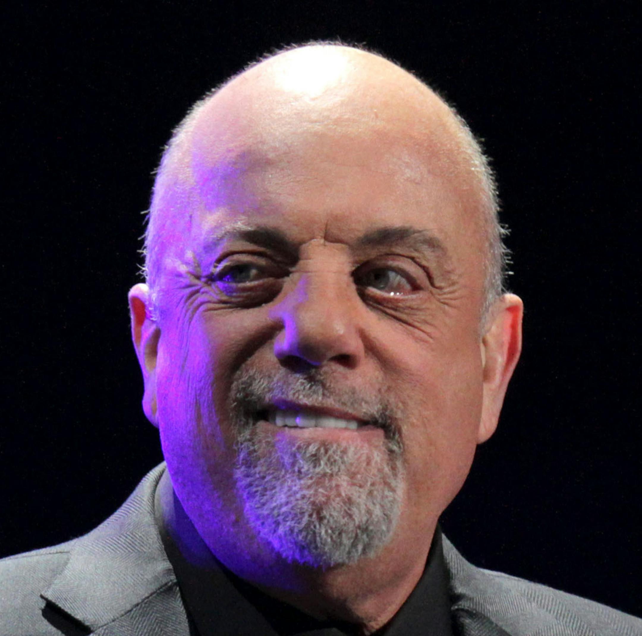 FILE - In this Jan. 27, 2014 file photo, Billy Joel performs his first show of his Madison Square Garden residency, in New York. Joel will set a new record for the most performances by any artist at Madison Square Garden with his upcoming 65th show scheduled for this summer. Tickets for the record breaking show, as well as his performances scheduled in May and June 2015, will go on sale to the general public on Saturday, Nov. 22, 2014. (Photo by Greg Allen/Invision/AP, File)