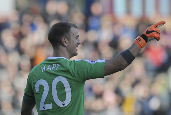Joe Hart gestures to his teammates during the English Premier League soccer match between Burnley and Chelsea at Turf Moor Stadium in 2018.