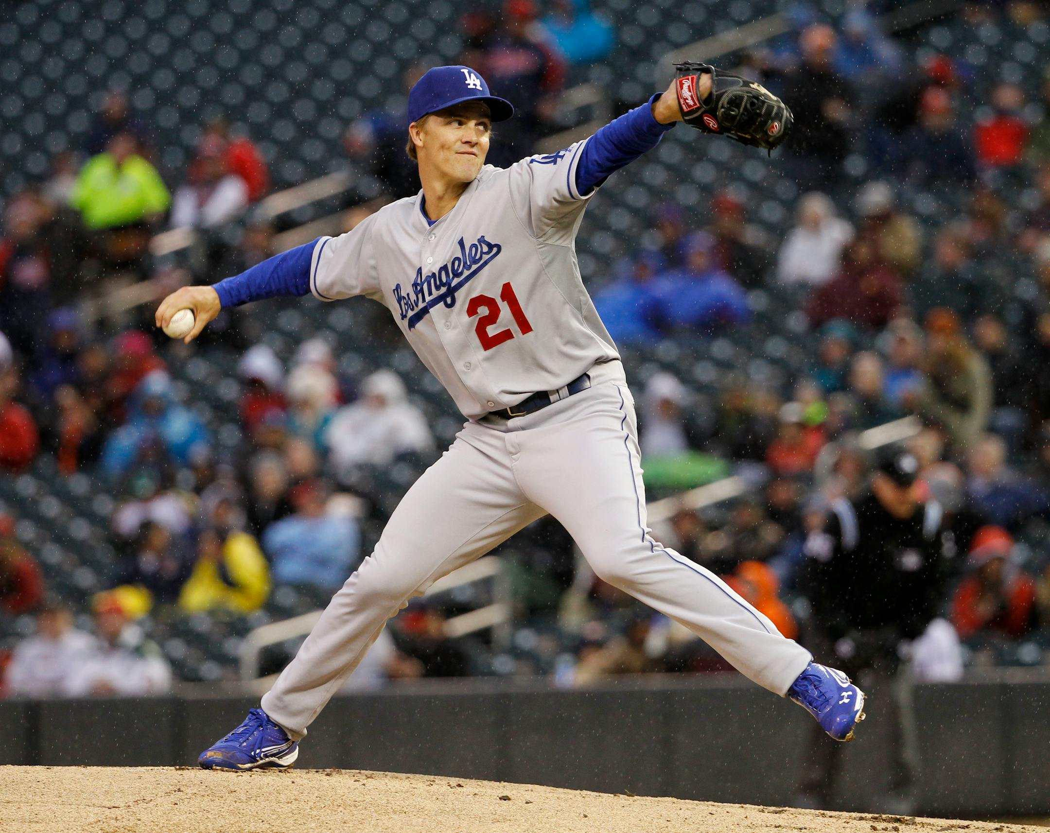 Los Angeles Dodgers starting pitcher Zack Greinke (21) delivers to the Minnesota Twins during the first inning of a baseball game in Minneapolis, Wednesday, April 30, 2014. (AP Photo/Ann Heisenfelt)