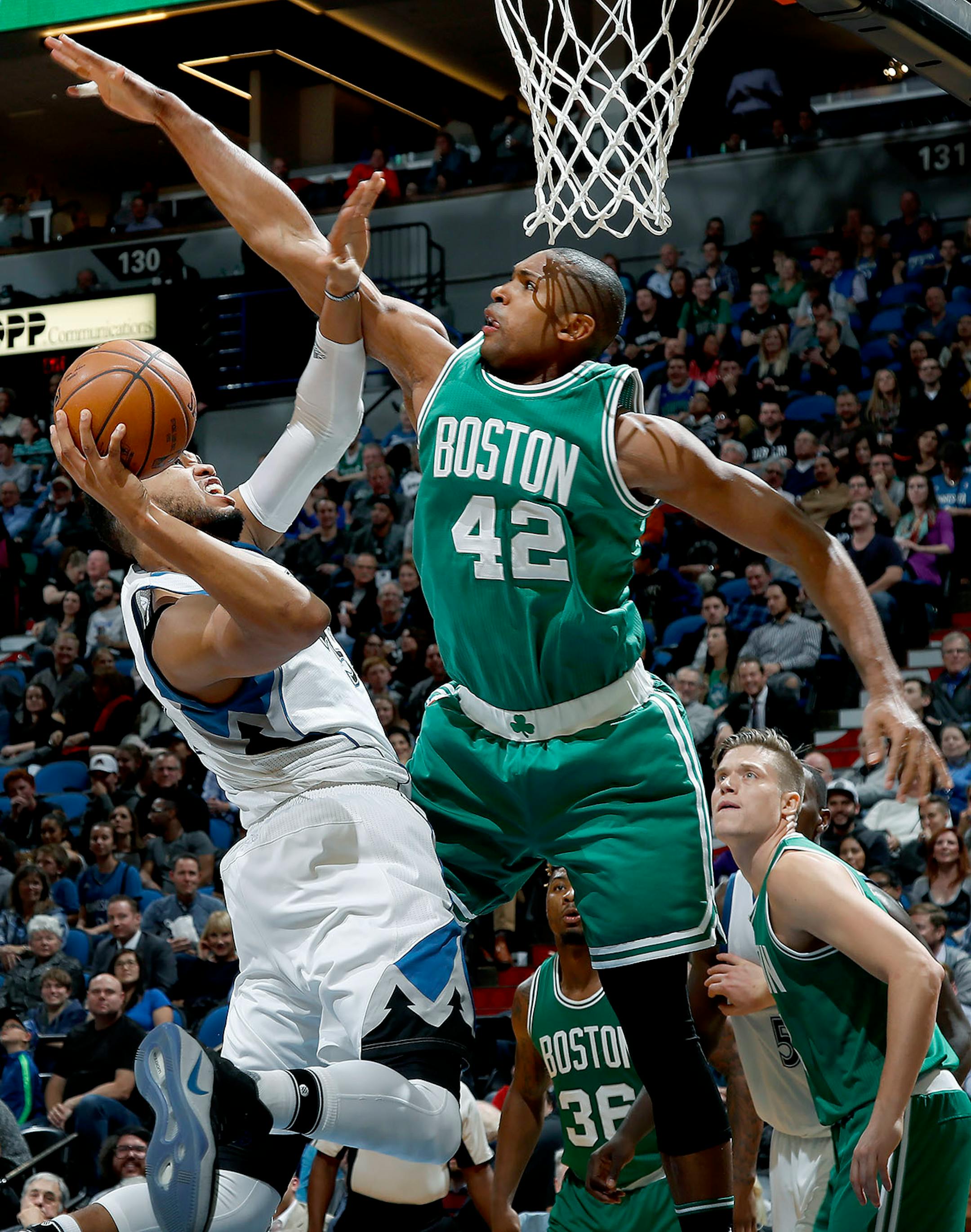 Karl-Anthony Towns was defended by Al Horford (42) in the fourth quarter.